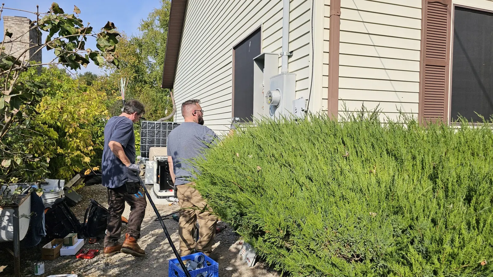 Axiom electrician wiring an outdoor disconnect